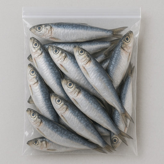 Packaged sardines in a clear plastic bag on a light gray background