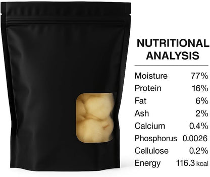 Black packaging with a window showing beige contents and nutritional analysis text on the right.